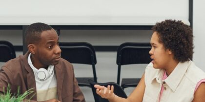 Two people in conversation with one another