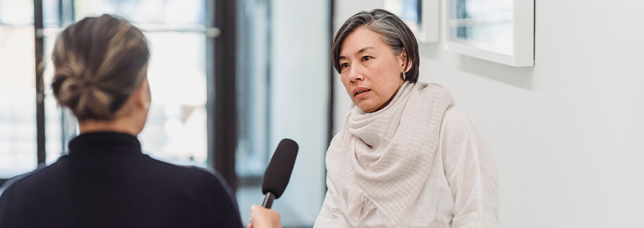 Photo of awoman being interviewed for the media