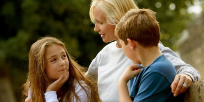 photo of a mother with two children